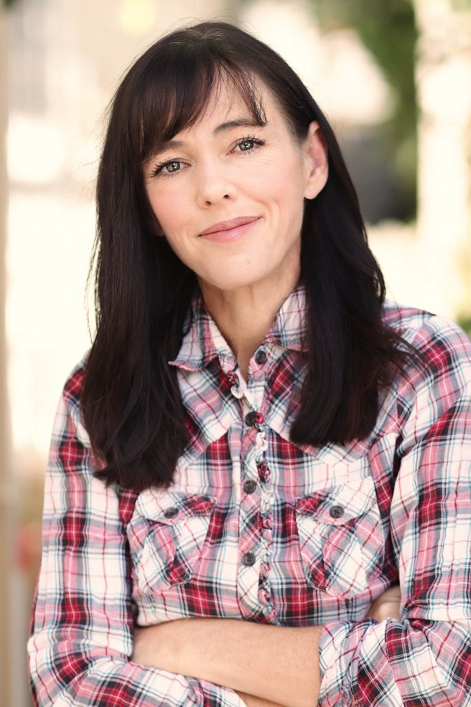 Middle-aged woman in a flannel shirt