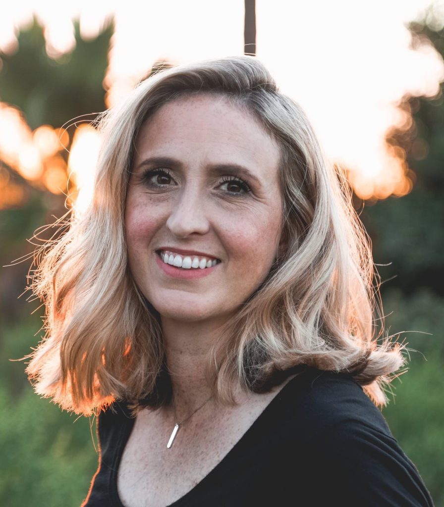 Middle-aged blonde woman smiling